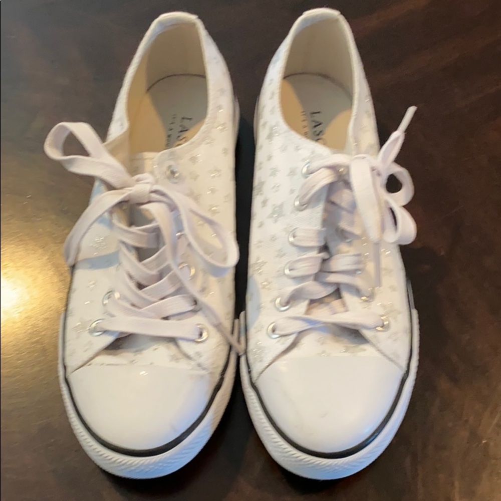 White low top tennis shoes with silver stars